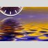 Tischuhr 30cmx30cm inkl. Alu-St&auml;nder -abstraktes Design  Wasser Spiegelung blau orange ger&auml;uschloses Quarzuhrwerk  -Wanduhr-Standuhr TU3168 DIXTIME  